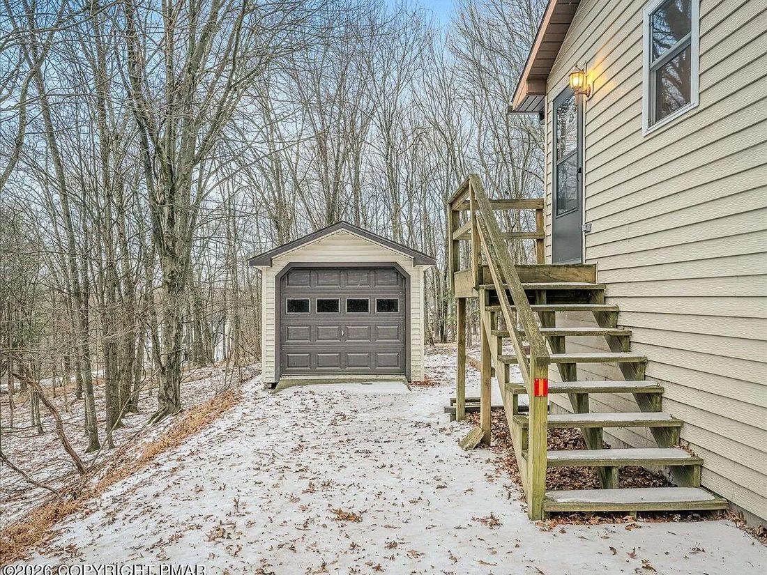 Side elevation and deck stairs at the Dallas, Pennsylvania property