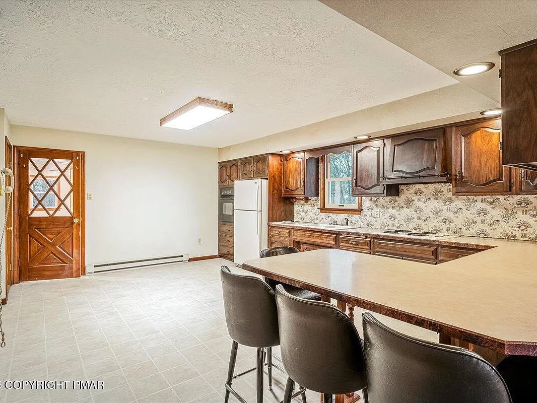 Kitchen with breakfast bar and seating in the Dallas, Pennsylvania house