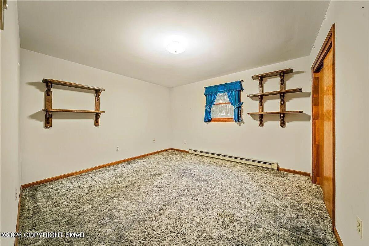Dallas PA secondary bedroom after — repainted, new carpet installed