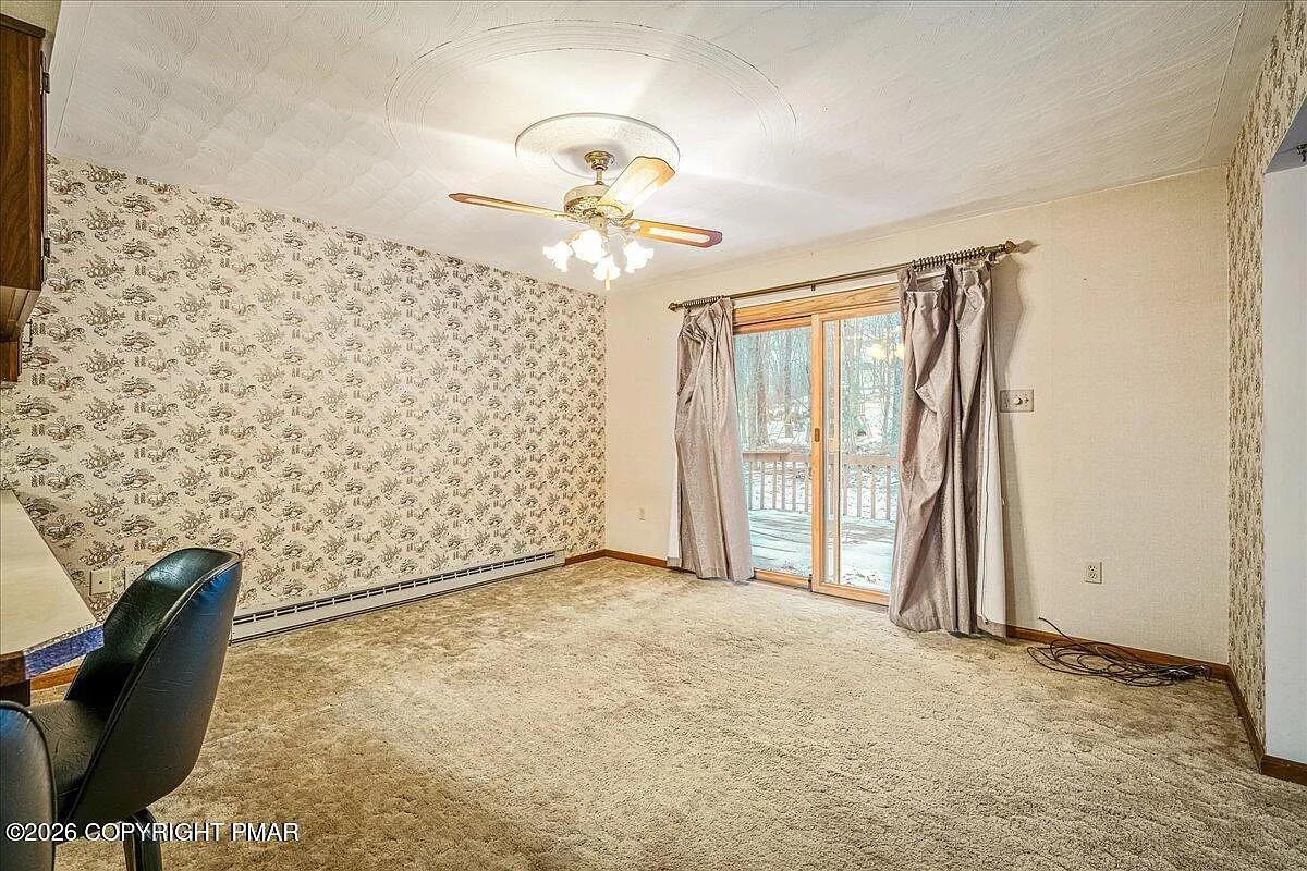 Dallas PA living room after — wallpaper removed, neutral walls, decluttered