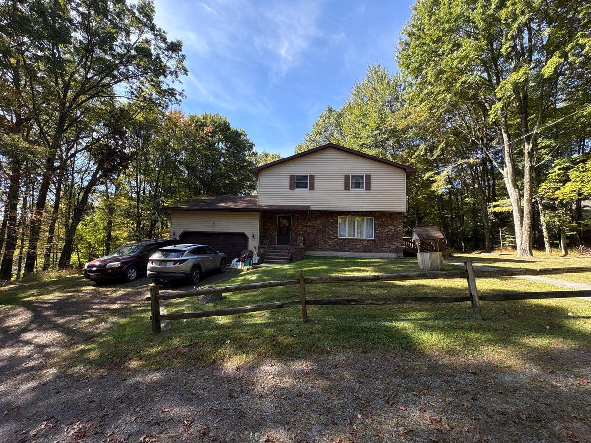 Dallas PA home before — split-level brick exterior