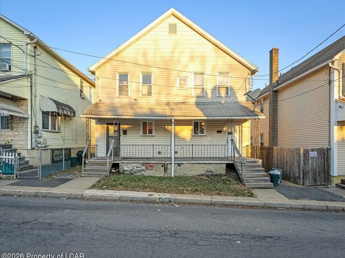 Two-unit property on Pershing Street in Wilkes-Barre, PA with covered front porch